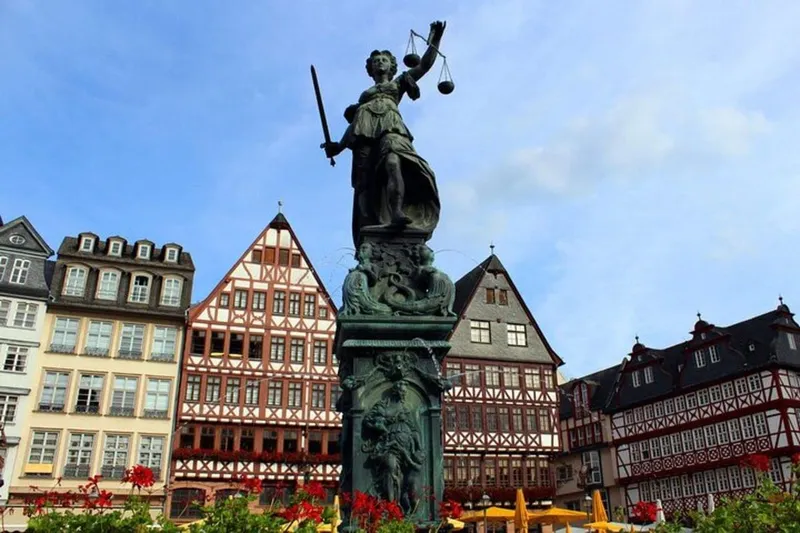 Guide showing visitors the cathedral and old-town lanes on a must-see frankfurt city tour in Frankfurt am Main